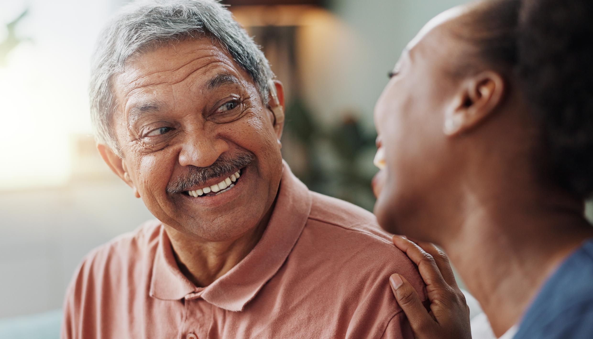 nurse smiling at man