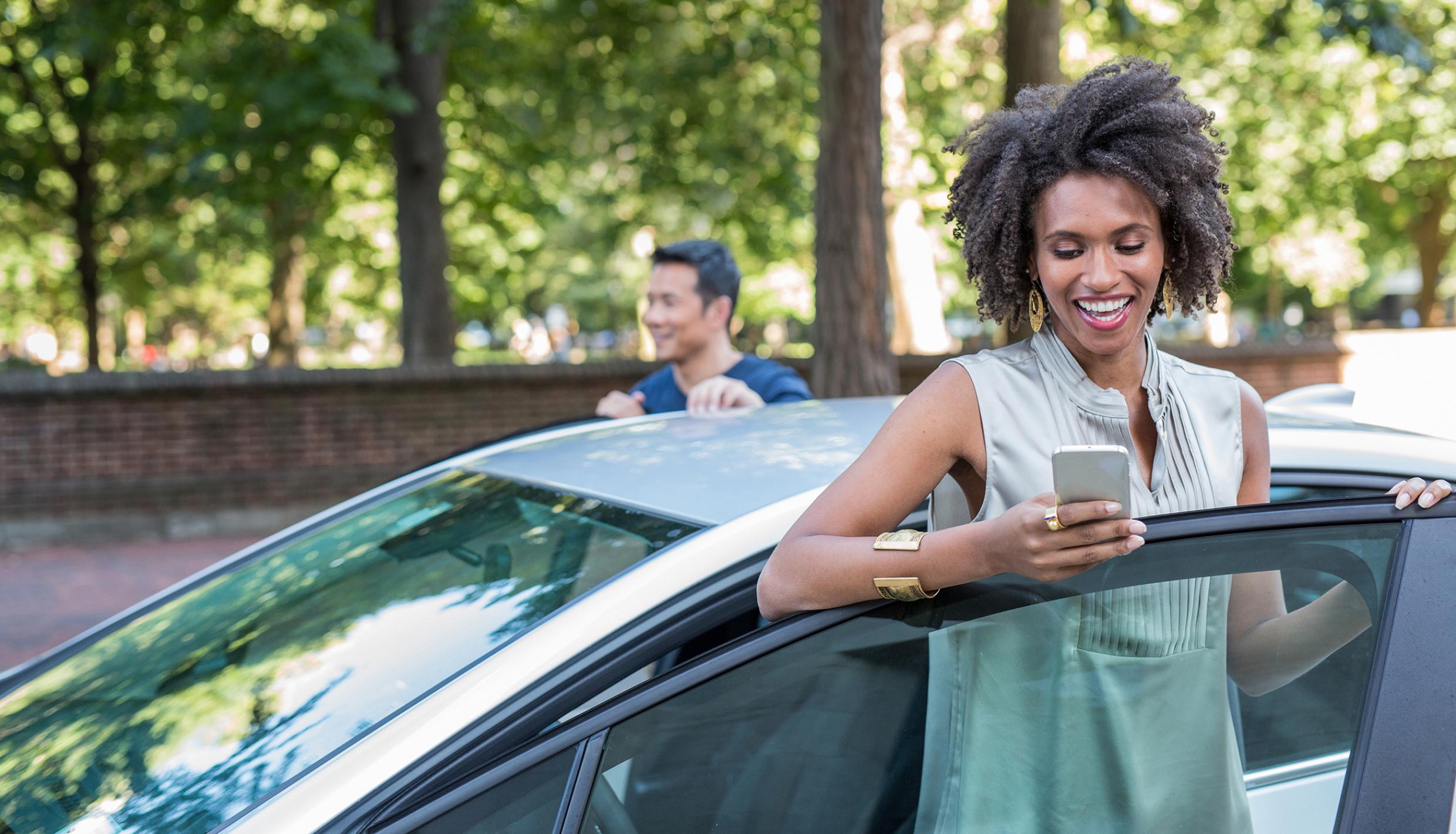Man and woman with car