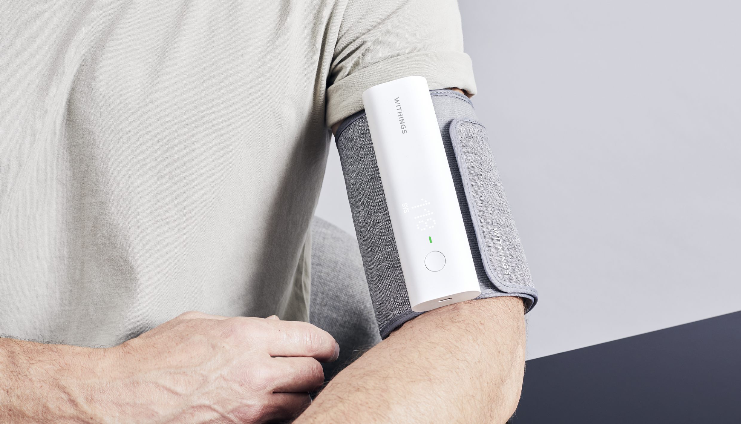 Man using blood pressure monitor