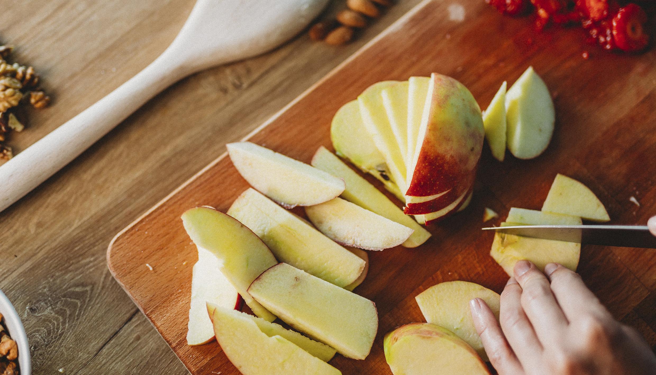 slicing apples with mixed nuts