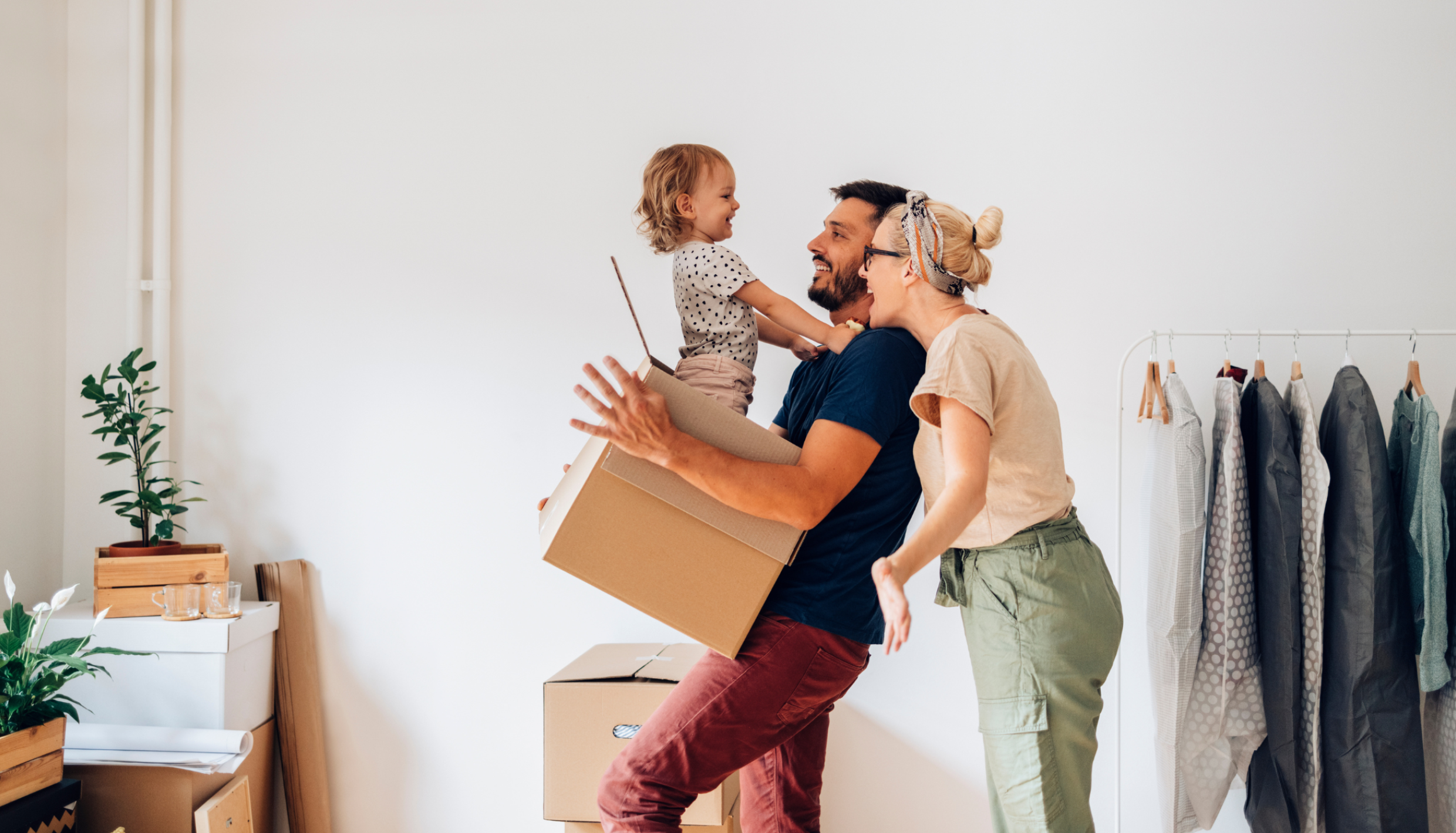 Happy Family with moving boxes