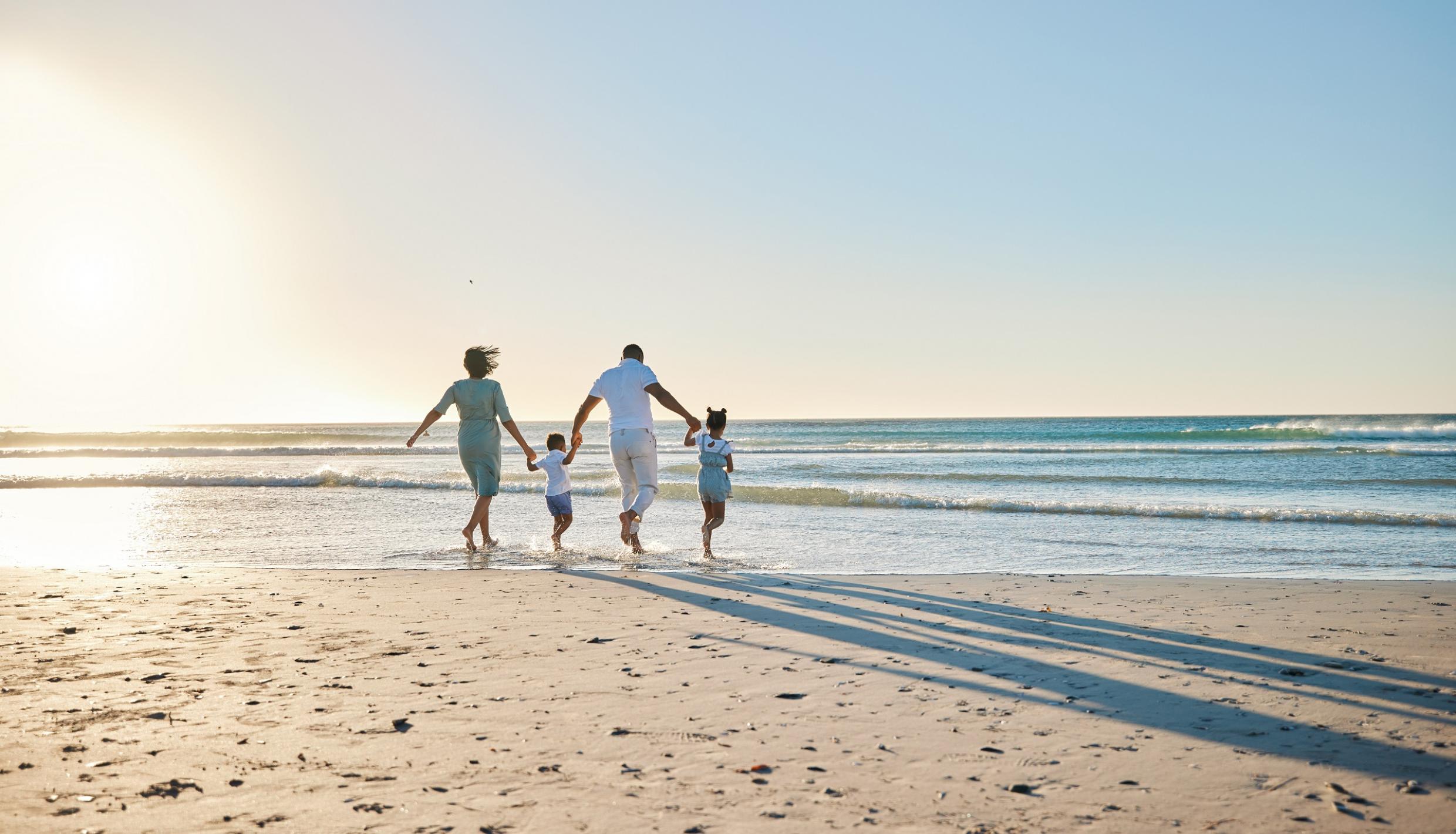 family walking on the beach
