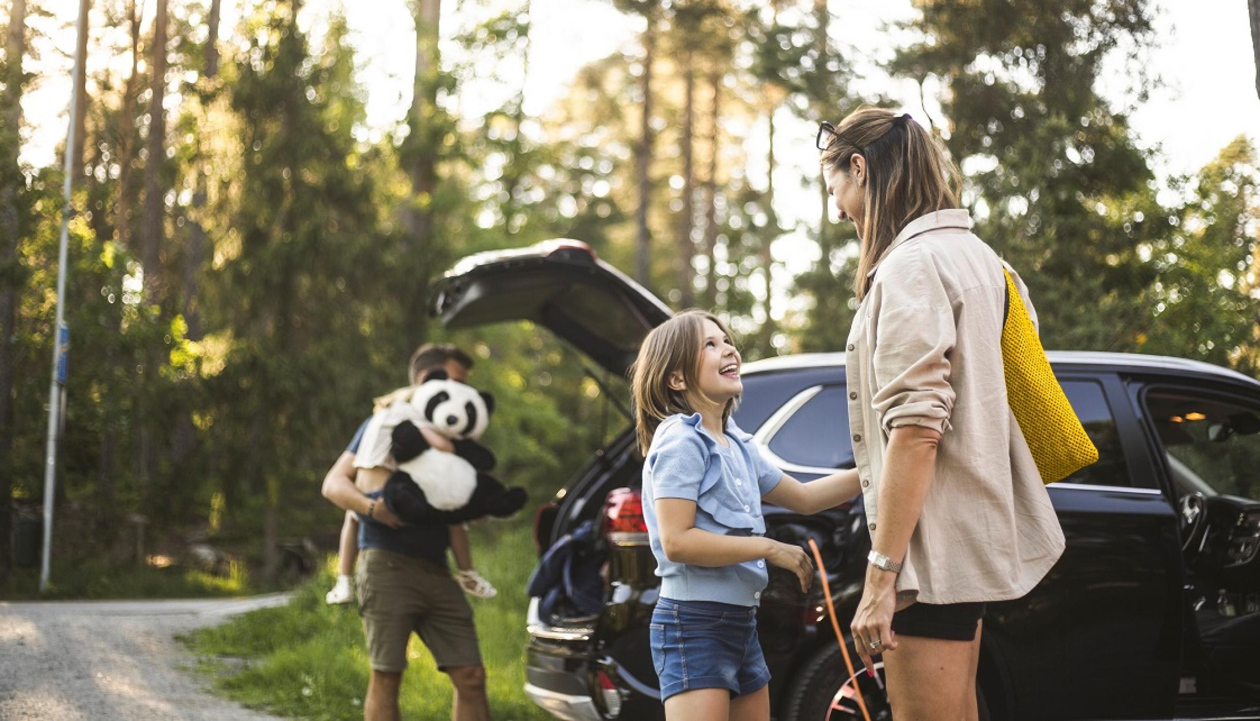 family getting into car
