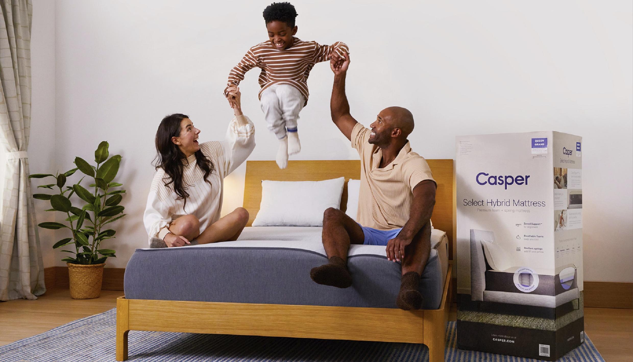 Family jumping on bed