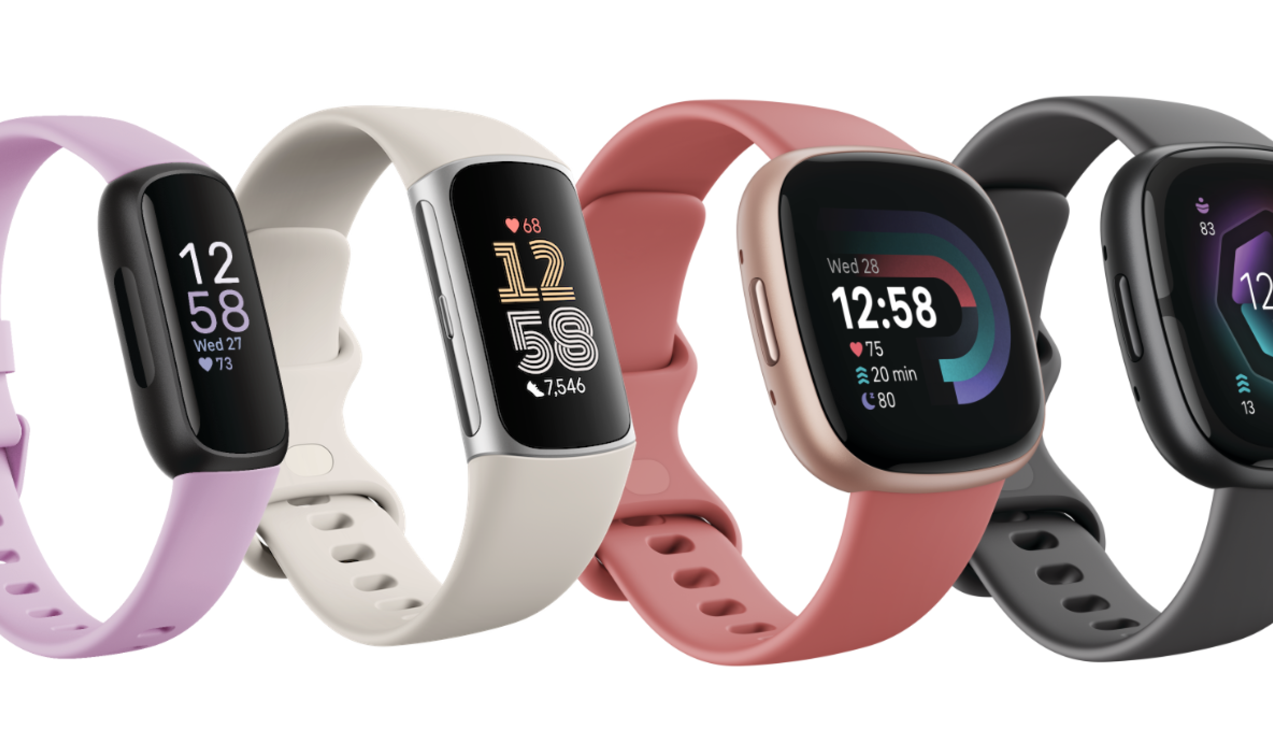 Cuatro dispositivos Fitbit alineados juntos