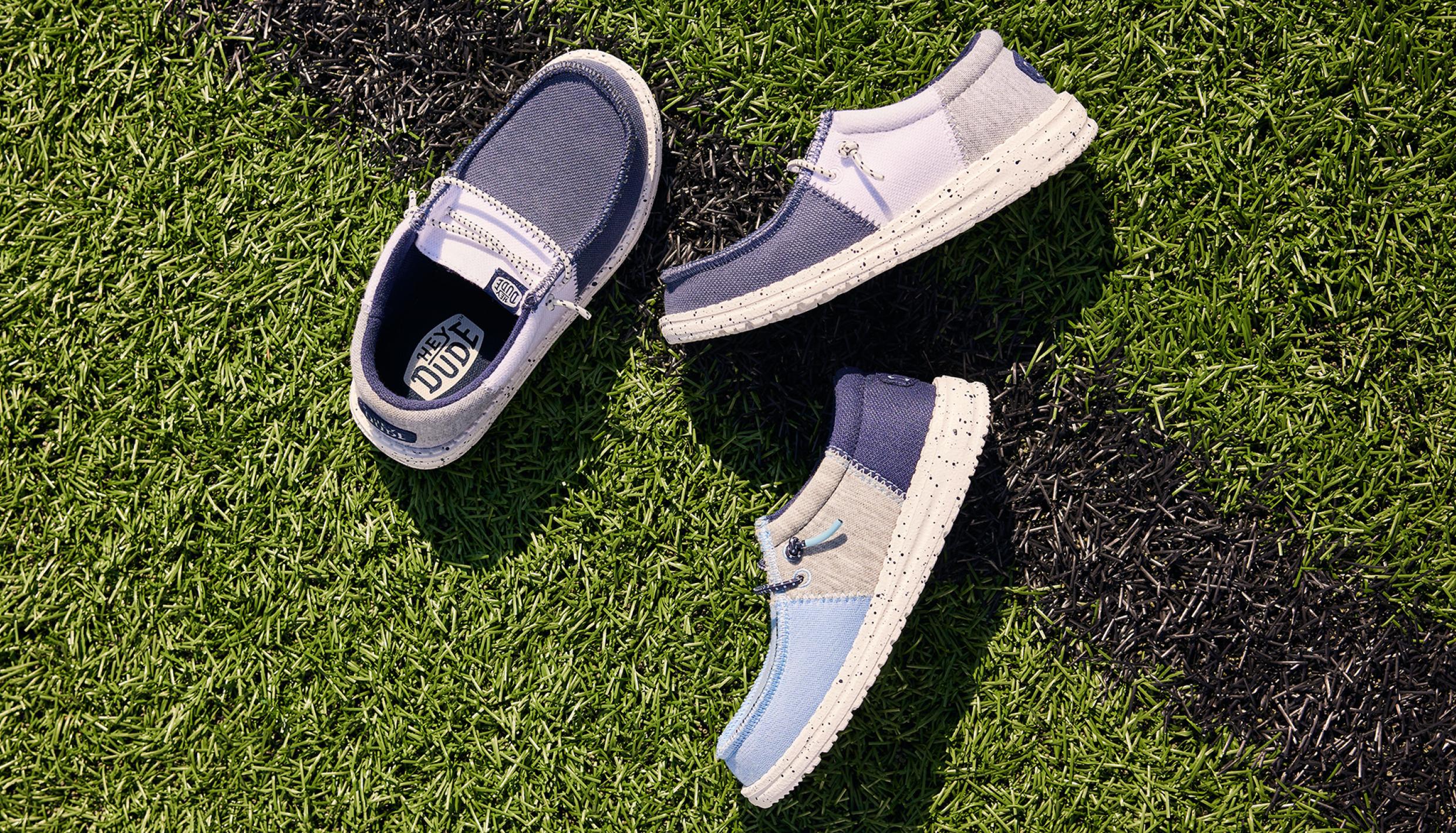 Three shoes on grass