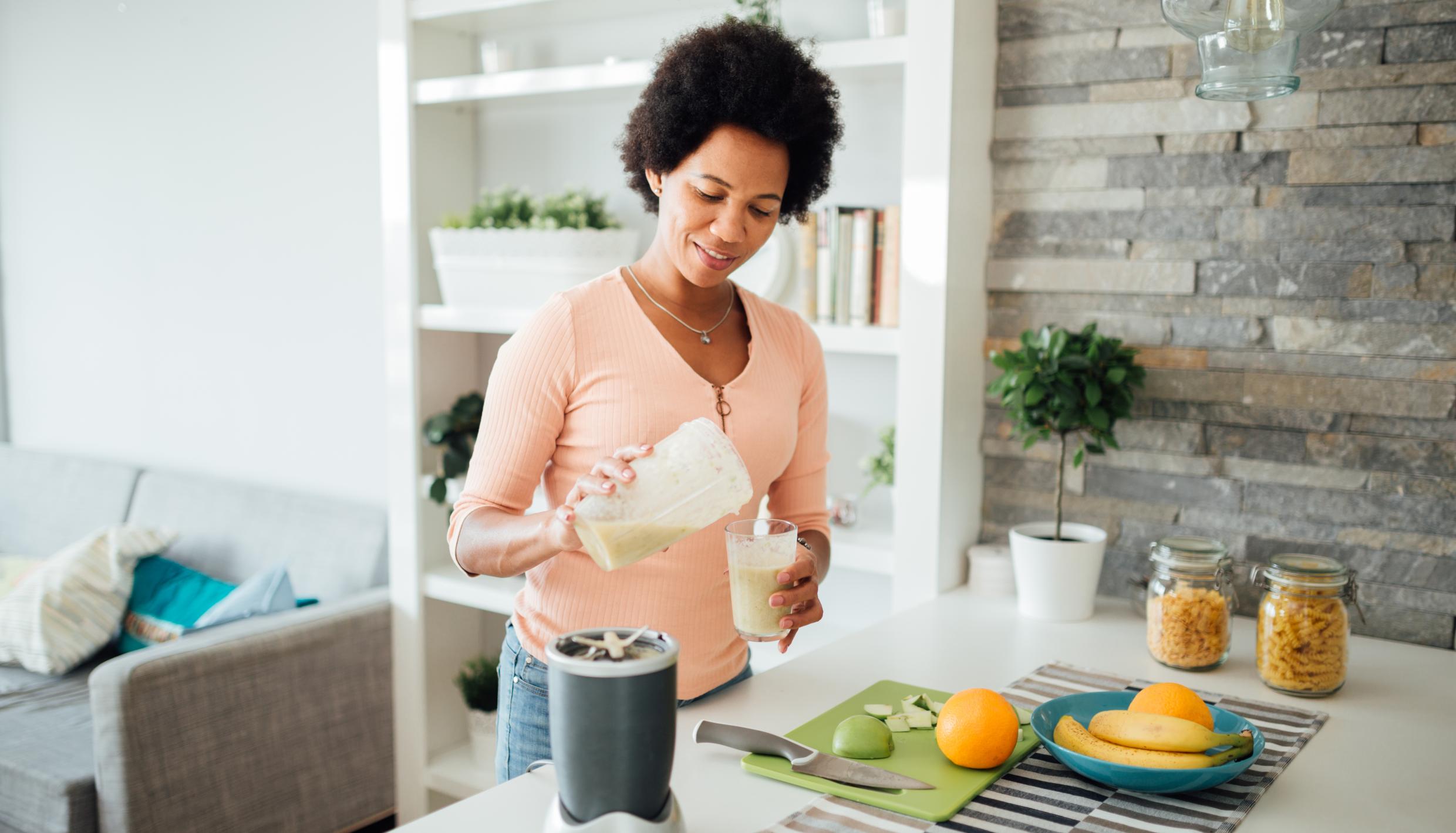 Woman making a smoothie