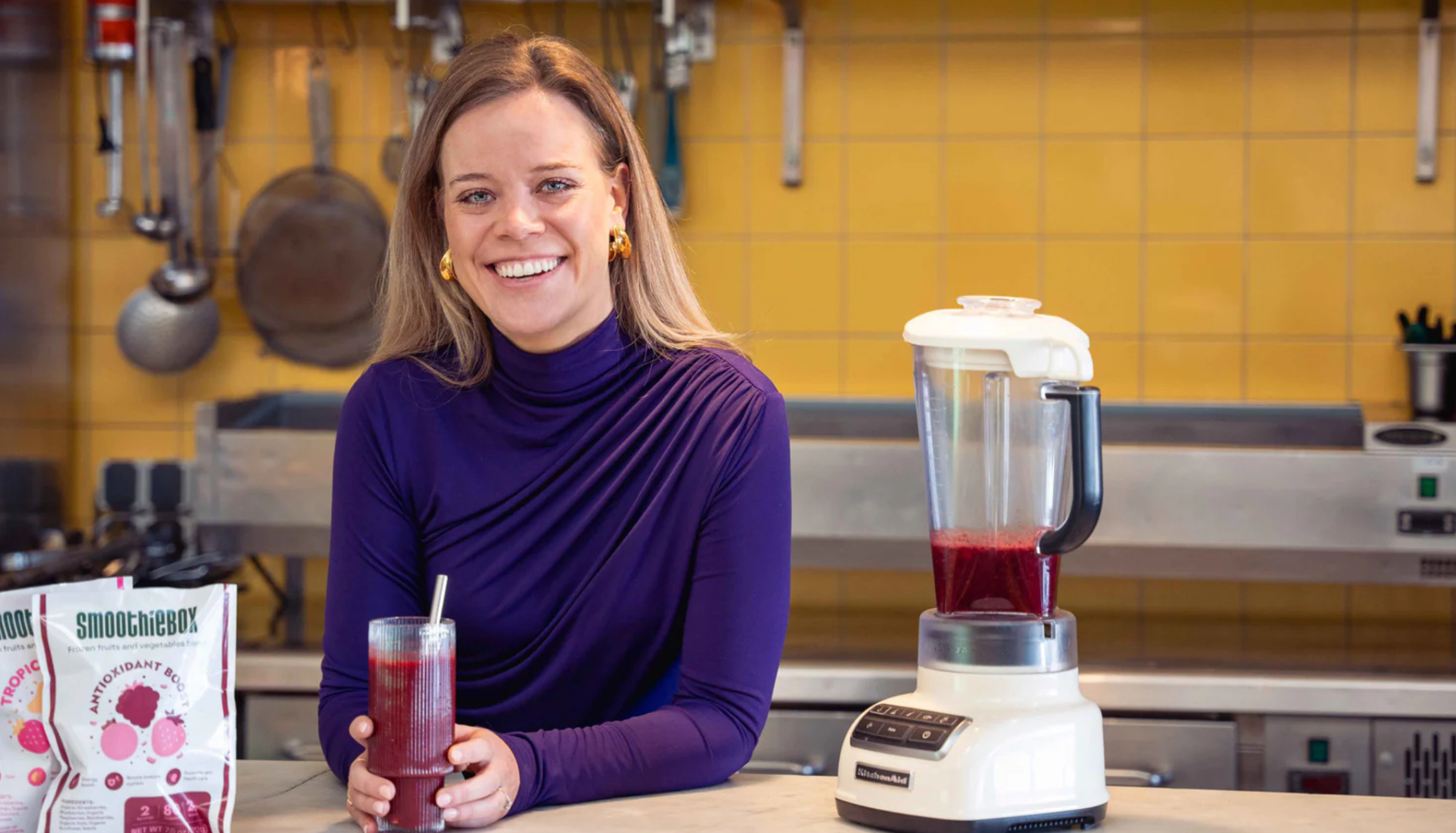 Woman at kitchen counter smiling