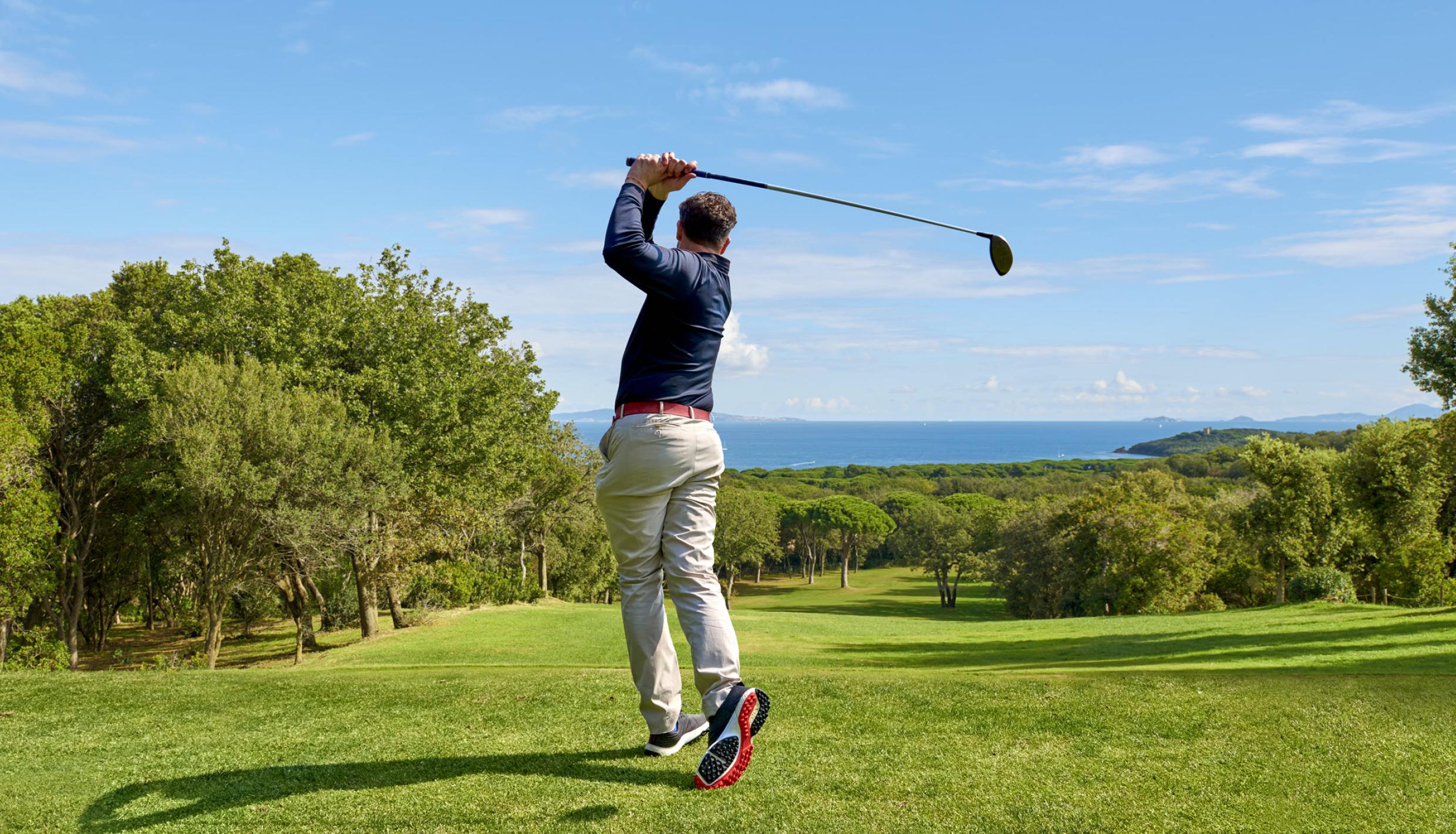 Man swinging golf club