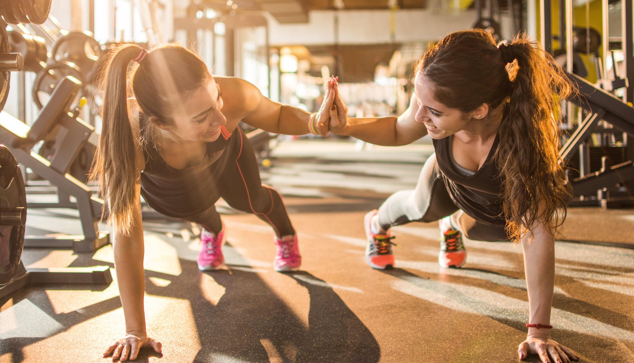 Two women working out at the gym