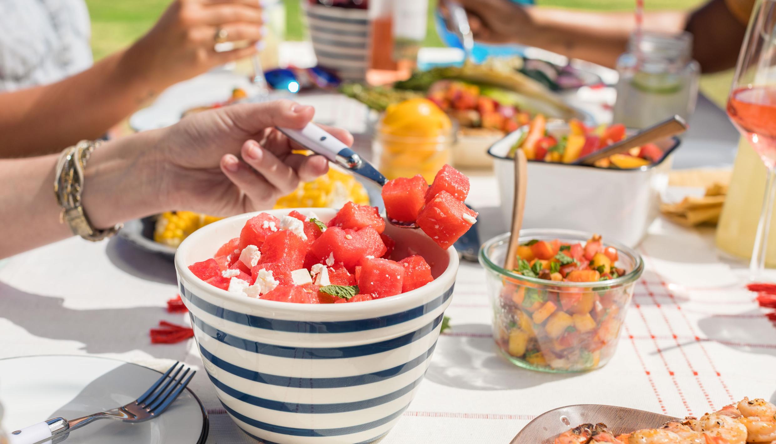 picnic table with summer food served