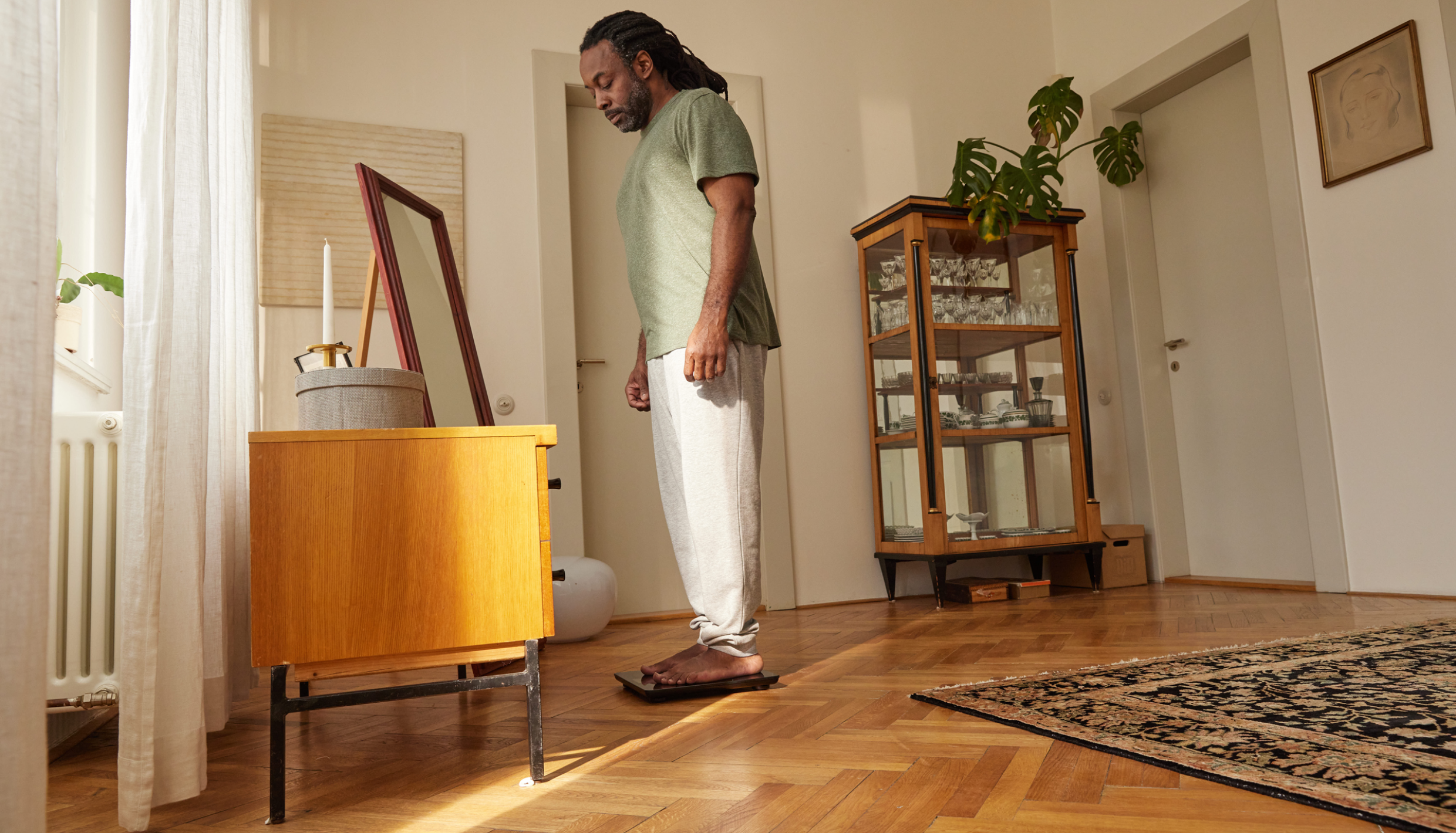 Man standing on a scale.