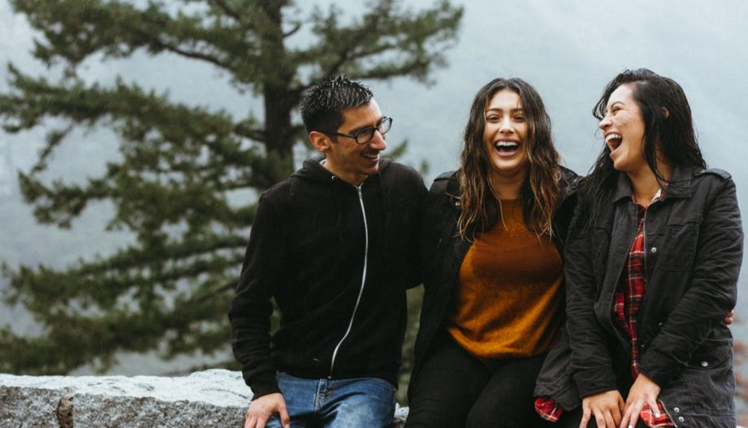 People near tree smiling