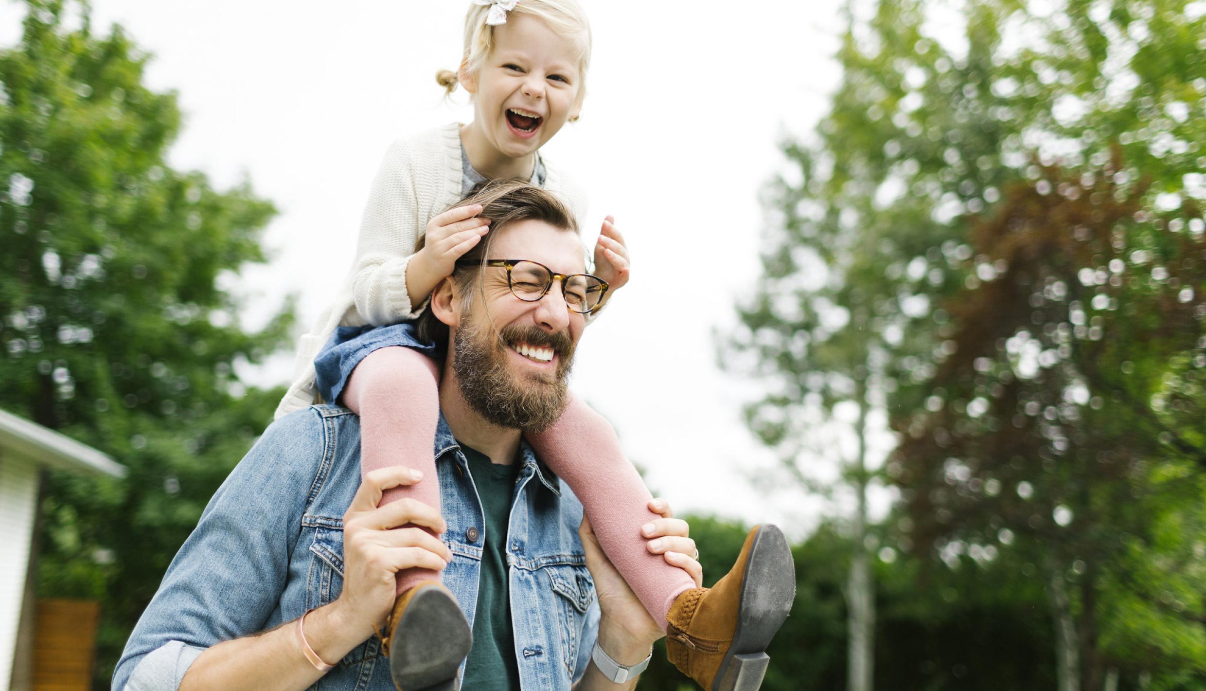 man and girl smiling