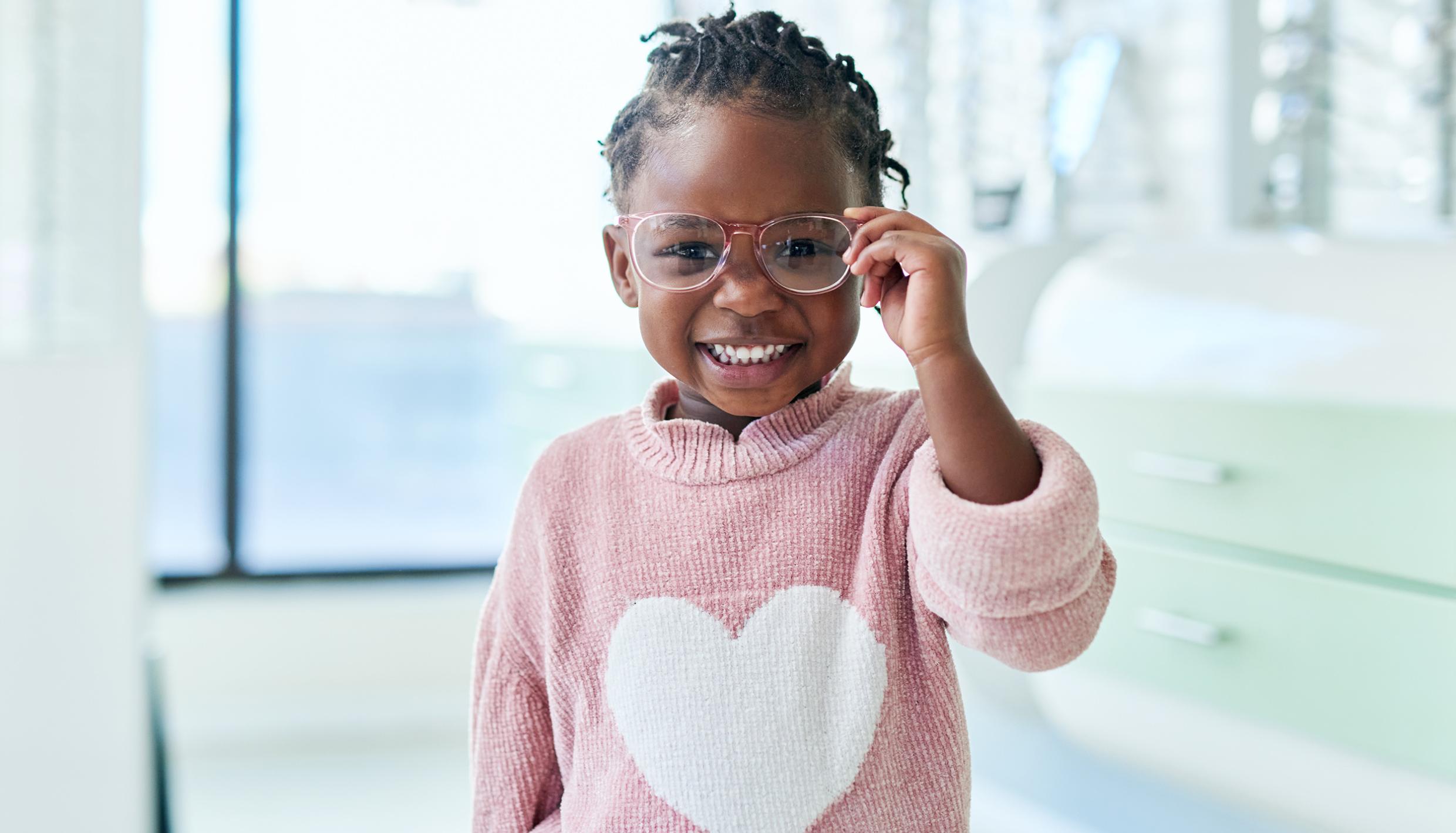girl wearing glasses and smiling