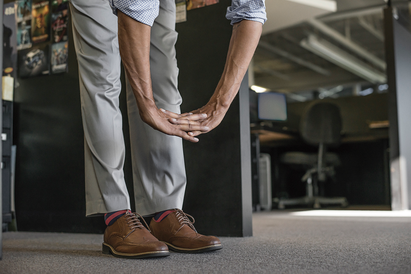 Man Stretching While At the Office
