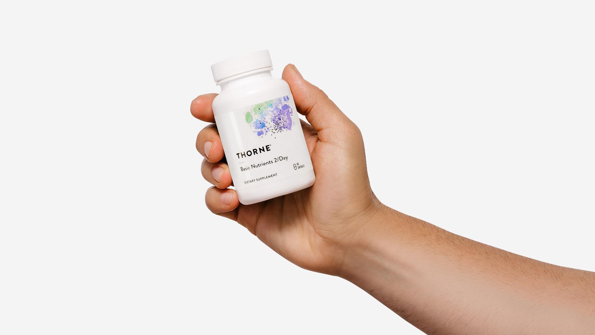 Hand holding vitamins
