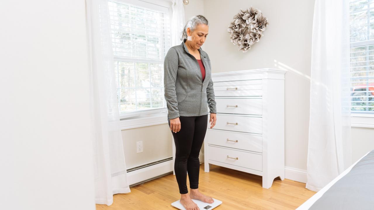 Woman standing on scale