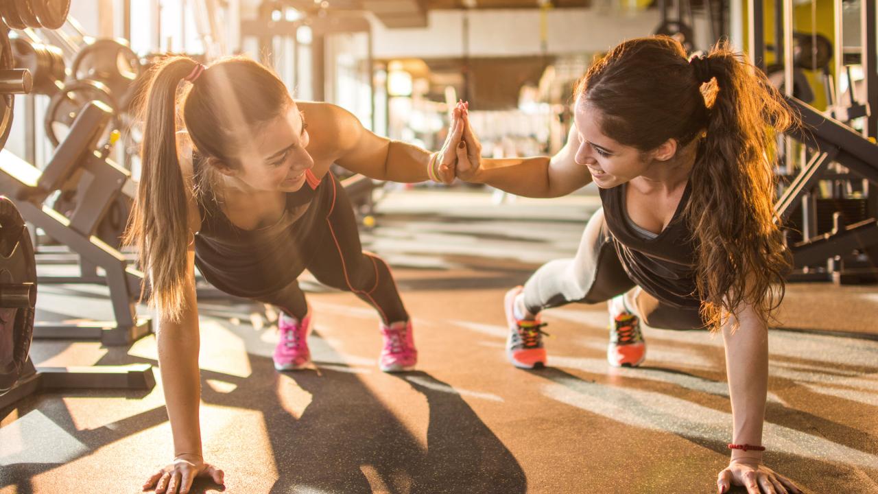 Two women working out at the gym