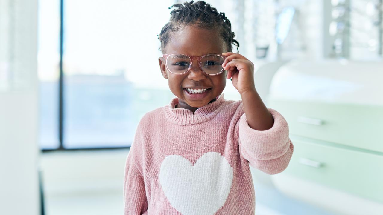 girl wearing glasses and smiling