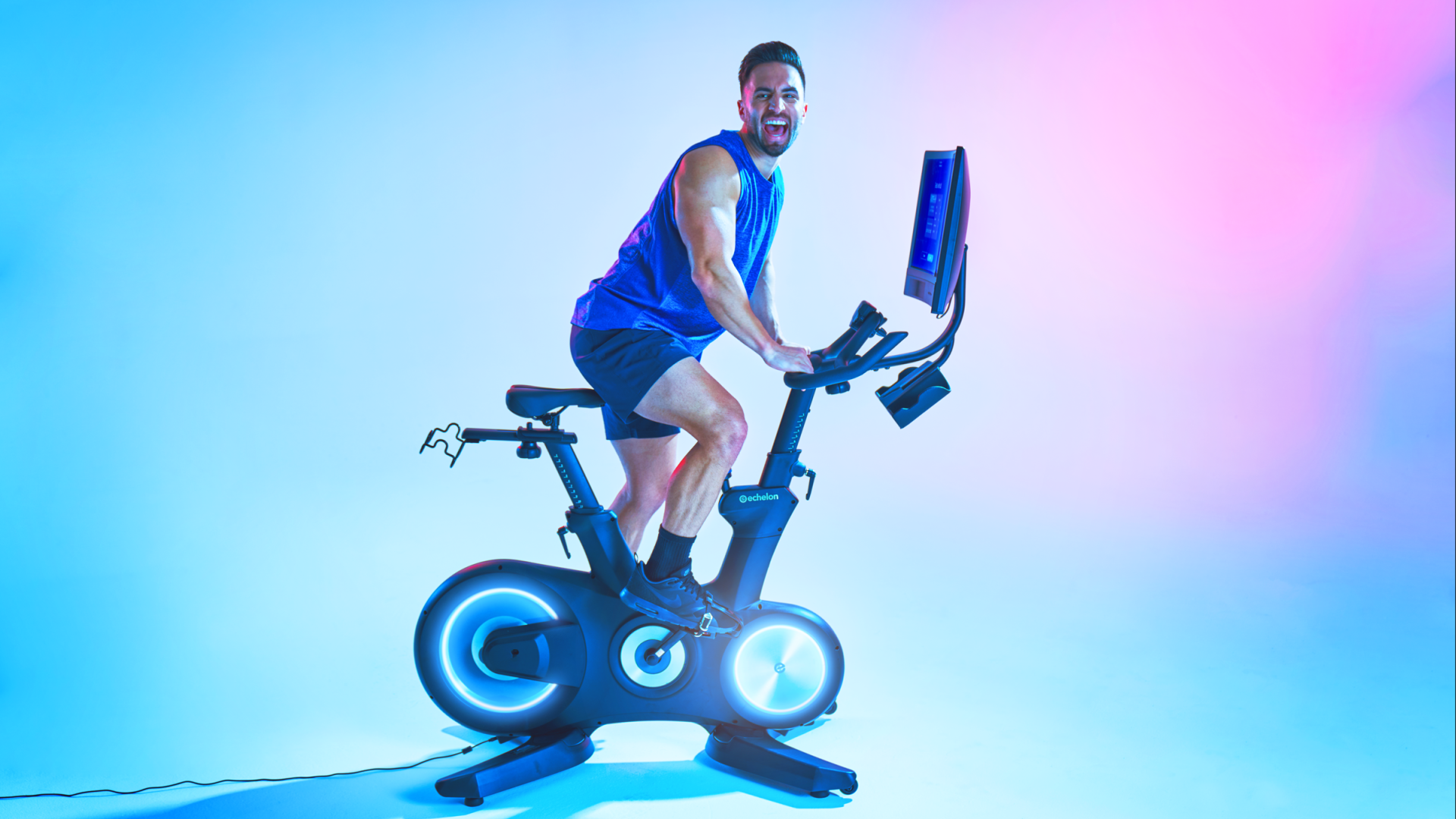 Man riding stationary bicycle
