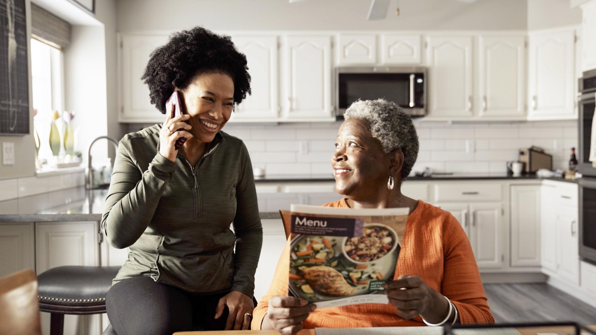 Woman on phone in kitchen