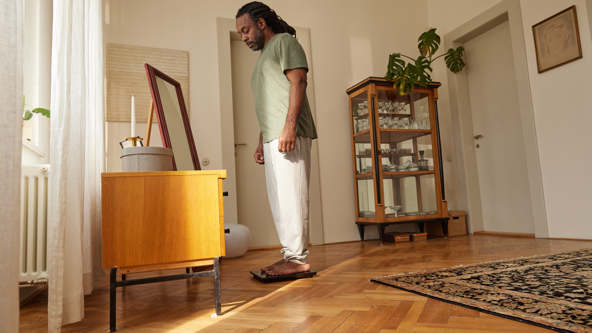 Man standing on a scale.