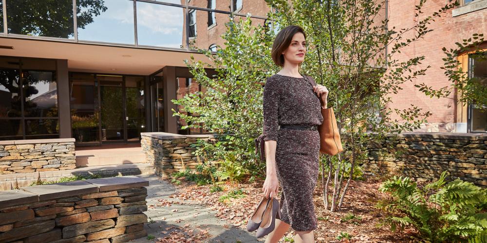 Woman walking in a garden