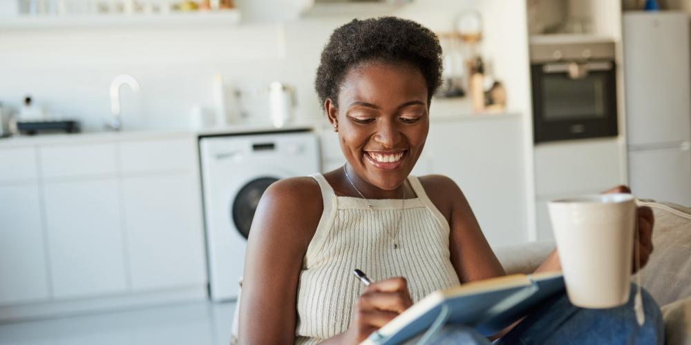 woman writing in notebook