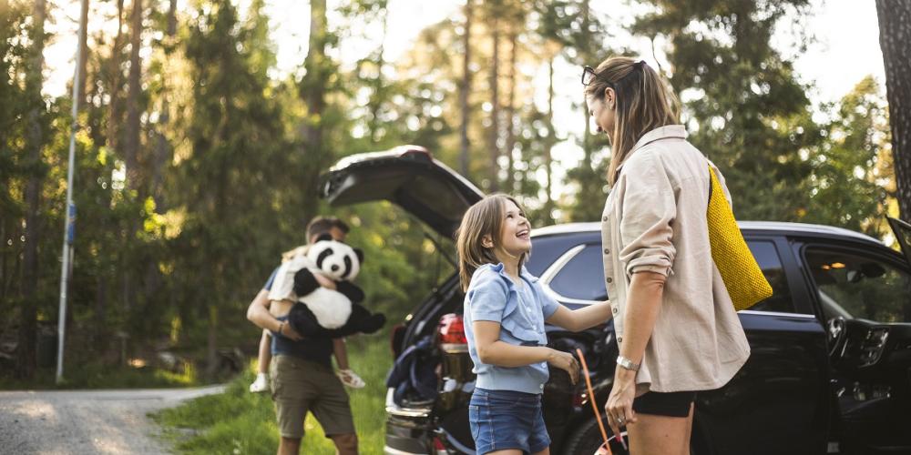 family getting into car