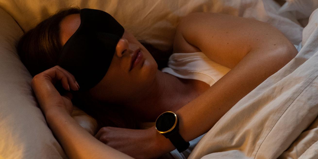 Woman sleeping while wearing smartwatch