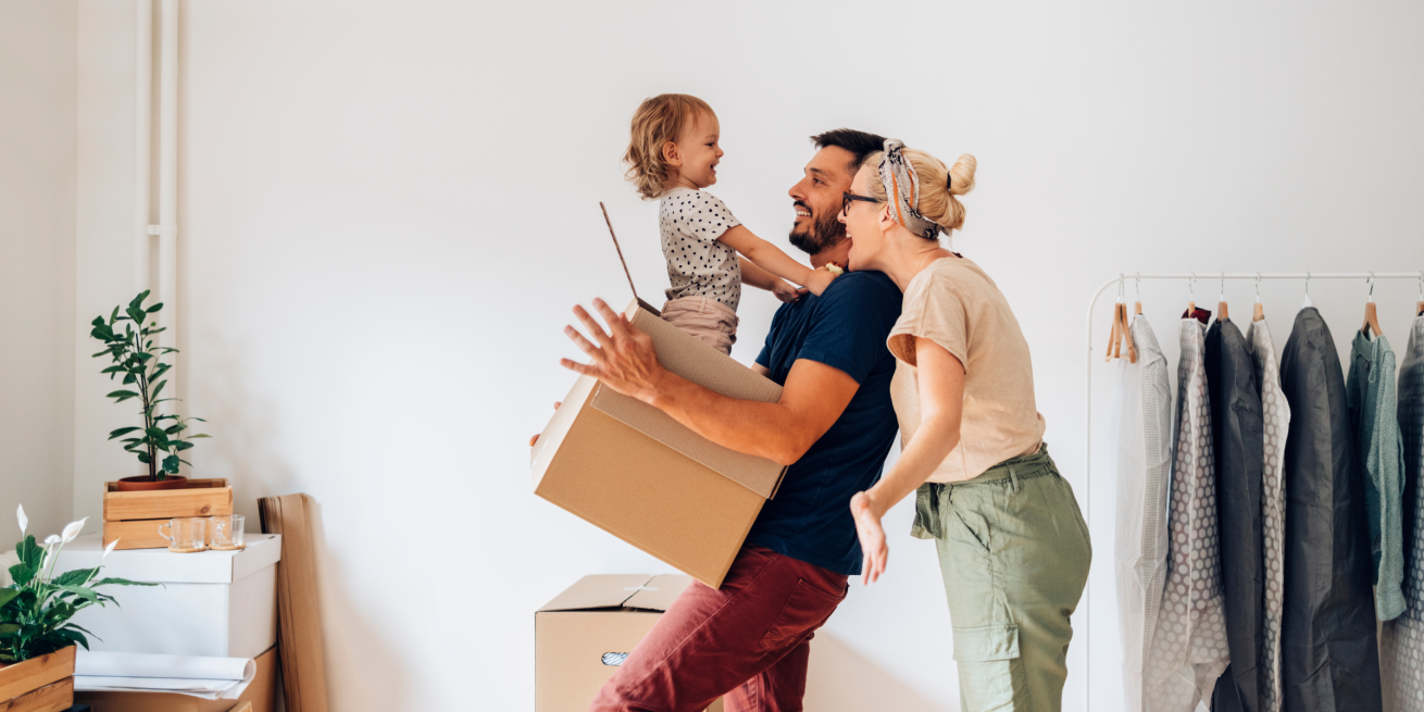 Happy Family with moving boxes