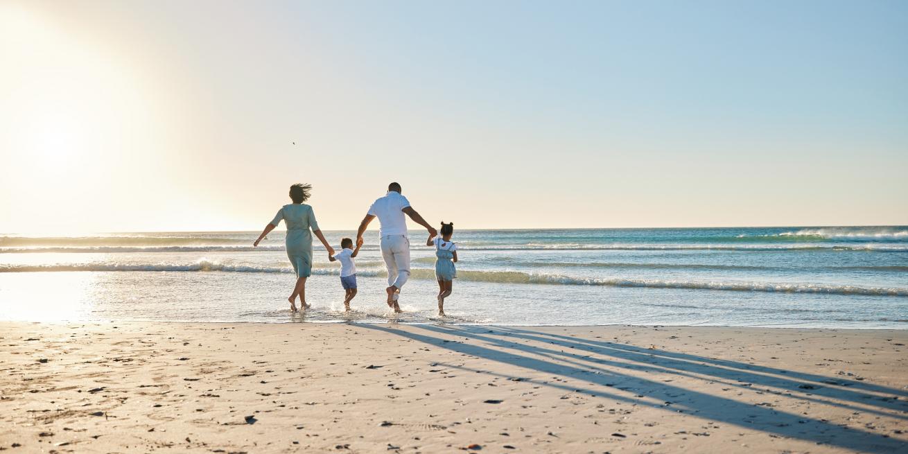 family walking on the beach