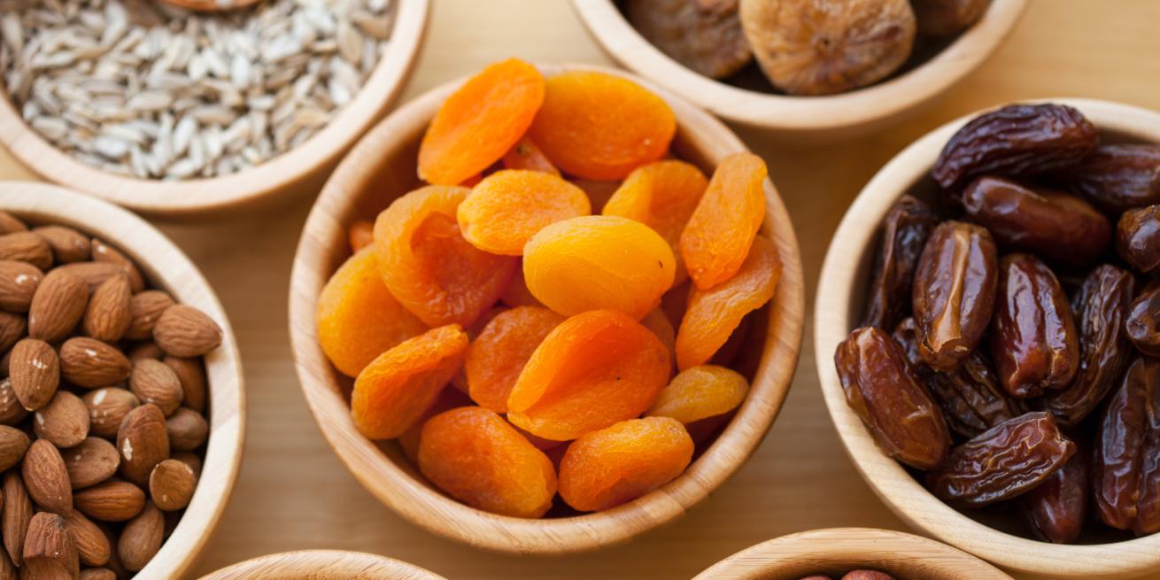bowls of apricots, dates, and almonds