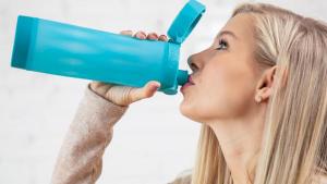 Girl drinking from water bottle