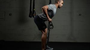 Man working out with TRX bands