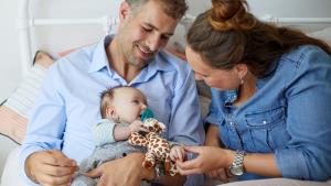 Couple holding baby