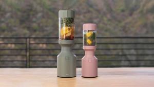 Grey and pink blender on table