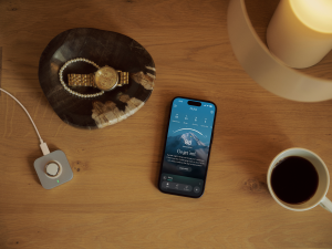 Phone and cup of coffee on table